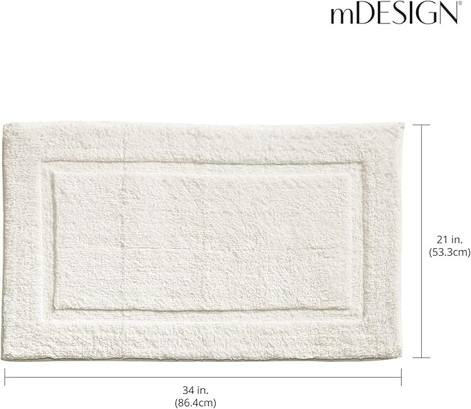 mDesign 100% Cotton Bath Mat - Soft Hotel-Style Rectangular Bathroom Floor Rug - Plush, Water Absorbent Cloth Bathmat for Outside Bathtub/Shower, Machine Washable Cotton Bath Rug, 2 Pack, Natural/Tan